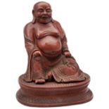 LARGE CARVED CINNABAR LACQUER FIGURE OF SEATED BUDDHA LATE 19TH CENTURY modelled wearing long