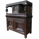 AN EARLY 17TH CENTURY JOINED OAK AND CARVED LIVERY CUPBOARD, originating from Yorkshire, 157 x 145 x