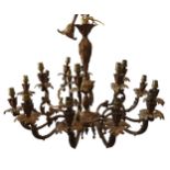 A LARGE ORNATE BRASS CHANDELIER, with 12 arms under a layer of six arms, 20th century, 60cm high x