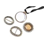 A COLLECTION OF JEWELLERY Two white metal and paste brooches and paste set buckle. A circular yellow