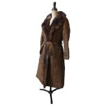 A NEW ZEALAND POSSUM FUR COAT, size 16, sable dyed with reversible silk lining, along with a