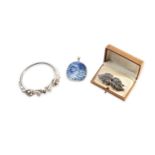 A QUANTITY OF SILVER JEWELLERY Including a heavy bangle in the form of two Chinese dragons, a