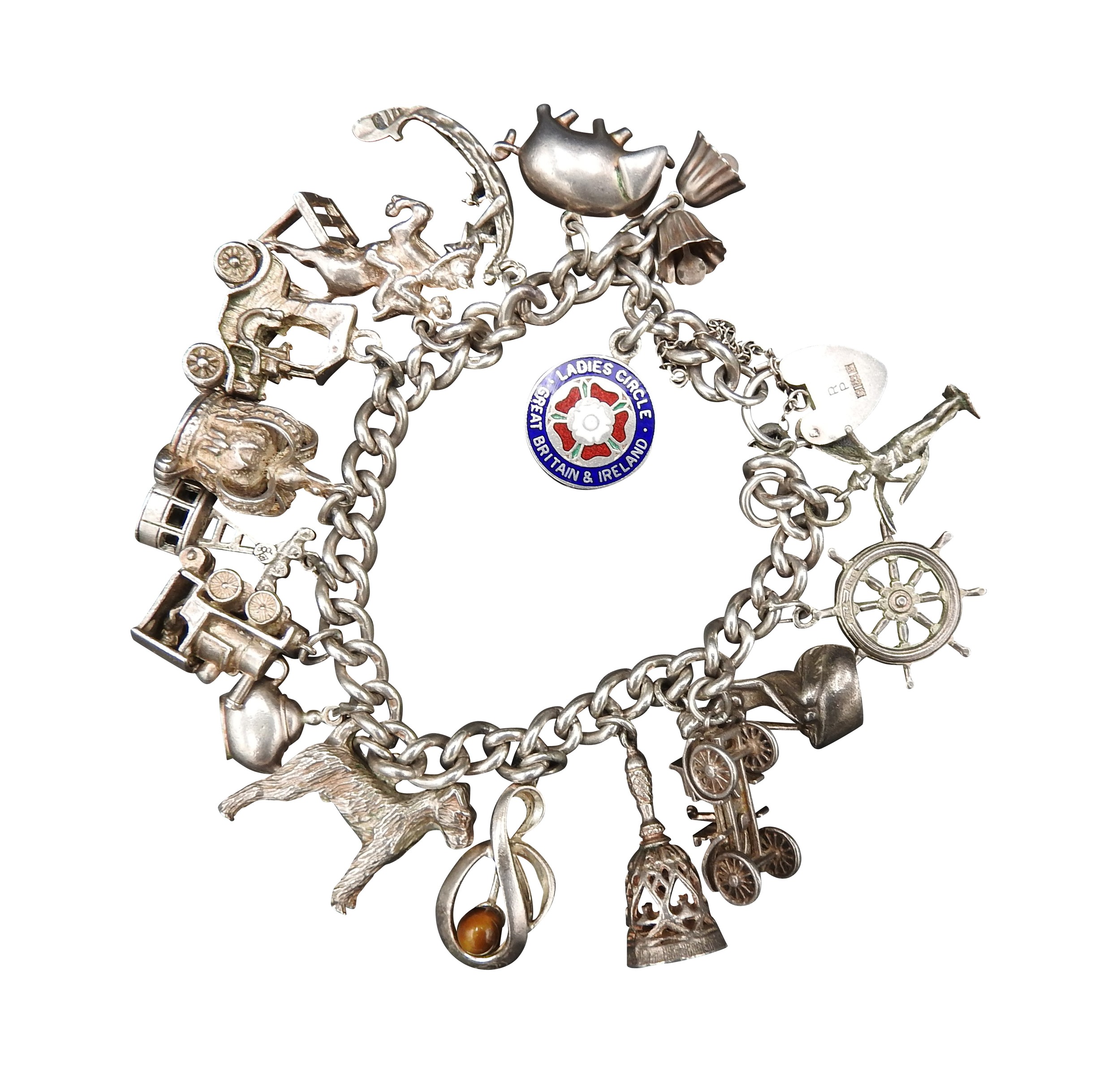A SILVER CHARM BRACELET, with sixteen assorted charms attached, total weight 72 grams