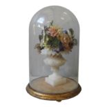 A VICTORIAN SHELLWORK FLORAL CENTREPIECE IN GLASS DOME, the ornately painted flowers in a pale