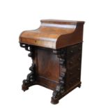 A VICTORIAN BURR WALNUT PIANO TOP DAVENPORT, with a concealed rising top, the intertior consists