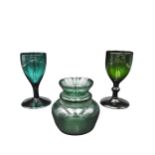 TWO EMERALD GREEN STEMMED GLASSES AND POSY VASE