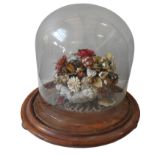 A VICTORIAN SHELL WORK FLORAL CENTREPIECE, in a Quartz crystal basket, on a wooden stand with