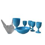 A VINTAGE TURQUOISE MILK GLASS WATER JUG, FOUR GOBLETS AND A FRUIT BOWL, circa 1950, all matching