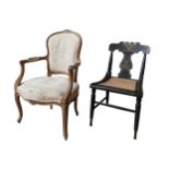 A FLORAL NEEDLEPOINT UPHOLSTERED FAUTEIL AND A PAINTED CANE SEAT BEDROOM CHAIR, the fauteil