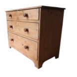 A 19TH CENTURY WAXED PINE CHEST OF FOUR DRAWERS, comprised of two short drawers over two long