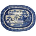 A 19TH CENTURY ENGLISH BLUE & WHITE MEAT PLATE, with a classic willow pattern design, 36 x 48.5 cm