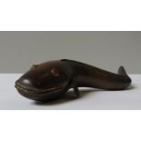 AN INDIAN BRASS ARTICULATED FISH ORNAMENT, early 20th century, with red paste inset eyes, 32 cm long