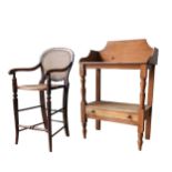 A VICTORIAN PINE WASH STAND AND A CHILD'S CANE SEAT HIGH CHAIR