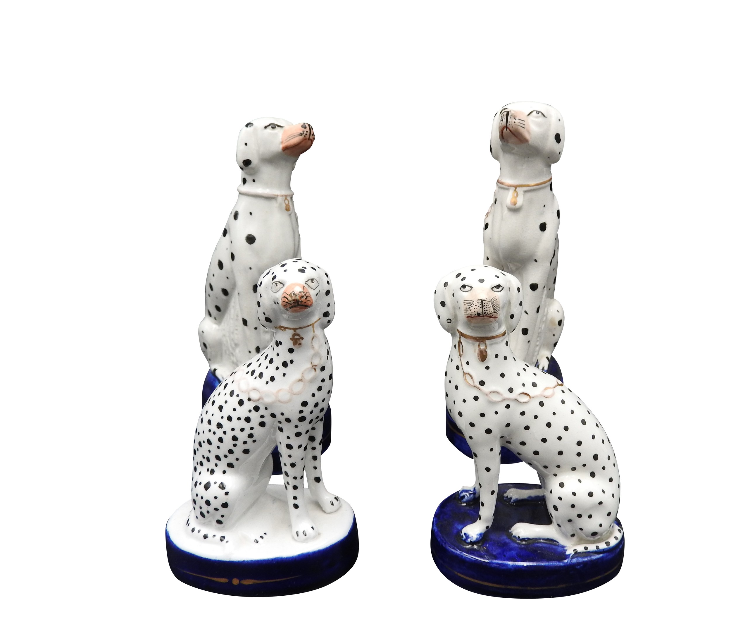 A NEAR MATCHING PAIR OF 19TH CENTURY STAFFORDSHIRE DALMATIONS WITH GILTS CHAINS AND ANOTHER