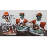 A pr OF 19TH CENTURY COW STAFFORDSHIRE SPILL VASES & 19th century spill vase in the form of a Zebra