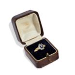 A SAPPHIRE AND DIAMOND 18CT GOLD RING Sapphire measures 4.2mm x 5.8mm and 2.5mm deep, surrounded