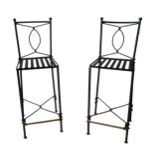 A PAIR OF WROUGHT IRON BAR STOOL SEATS, with twist backs and stretchers, and brass foot rails, 106 x
