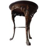 A VINTAGE CAST-IRON PUB TABLE WITH CIRCULAR TOP, with Brittania decoration to the top of the legs,
