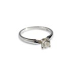 A PLATINUM SOLITAIRE DIAMOND RING Size M, Weight 3.4 grams. Diamond measures 5.2mm across Stamped