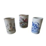 TWO CHINESE FAMILLE ROSE BRUSH POTS together with a blue and white brushpot, two with apocryphal