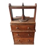 A VICTORIAN MAHOGANY BOOK PRESS / CHEST, on a plinth base with three long drawers, with turned