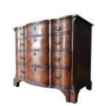 AN EDWARDIAN WALNUT AND MAHOGANY SERPENTINE CHEST OF DRAWERS, in a George II style , with an