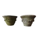 A PAIR OF WEATHERED RECONSTITUTED STONE TAPERED GARDEN PLANTERS, with swag decoration, 36 cm high