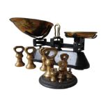 A SET OF VINTAGE CAST-IRON & BRASS PAN SCALES, with a set of 7 bell weights and three other bell