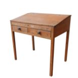 A VINTAGE PINE CLERK'S DESK, with two short frieze drawers, a sloping top which lifts to reveal