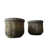 A PAIR OF WEATHERED RECONSTITUTED STONE GARDEN PLANTERS, with repeating foliate pattern, 39 cm