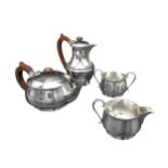 A 20TH CENTURY FOUR PIECE SILVER TEA SERVICE, comprising of tea pot, hot water jug, milk jug and