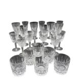 A SUITE OF WATERFORD CUT CRYSTAL STEMMED GLASSES, comprising of flutes, tumblers and goblets, all