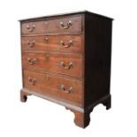 A GEORGE III OAK CHEST OF FOUR DRAWERS, the four long graduated drawers with brass escucheons and