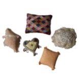 A VICTORIAN PATCHWORK PIN CUSHION  AND FOUR OTHER PIN CUSHIONS.