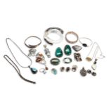 A QUANTITY OF SILVER DRESS JEWELLERY Including modern semi precious gem set pendants and rings,