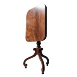 A VICTORIAN MAHOGANY WINE TABLE, the tilting oblong top on a turned pillar, supported by three swept