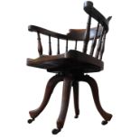 A 19TH CENTURY MAHOGANY REVOLVING DESK CHAIR, the bow back top rail supported by turned pillars,