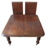 A VICTORIAN MAHOGANY PULL-LEAF DINING TABLE, the top with  deep border moulding, upon ballaster
