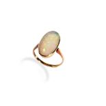 AN EARLY 20TH CENTURY WHITE OPAL RING the cabochon-cut opal being collet set between a tapered