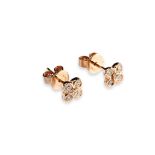 A PAIR OF ROSE GOLD AND DIAMOND STUDS each set with five brilliant-cut diamonds.  Stamped 750,