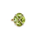 A LATE VICTORIAN PERIDOT & DIAMOND RING In a stylised cross design claw and collet set with  small