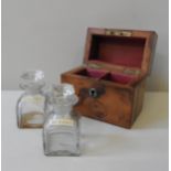 A PAIR OF VINTAGE GLASS SCENT BOTTLES IN A FITTED  DOMED WALNUT BOX, each scent bottle standing 8 cm