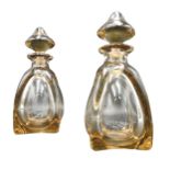 A PAIR OF SKRUF SCANDANAVIAN STUDIO ART GLASS DECANTERS, in amber tones, etched with Skruf maker's