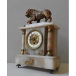 AN 19TH CENTURY ONYX MANTEL CLOCK, surmounted by gilt metal lion figure the dial flanked by two