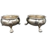 A PAIR OF GEORGIAN SILVER SALT CELLARS, by Henry Chawner, London 1758, on three hoof feet, 5.5 oz