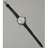 A SILVER MANUAL WIND TRENCH WRIST WATCH Circa 1940's. with Arabic numerals and sub second dial. On