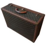 A VINTAGE LOUIS VUITTON BROWN LEATHER CLOTH SUITCASE, with LV monogram pattern, monogrammed