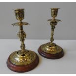 A PAIR OF VICTORIAN LACQUERED BRASS CANDLESTICKS, in the Renaissance style, late 19th century, on