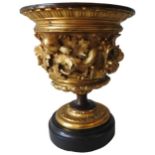 A FRENCH GILT BRONZE URN, late 19th/early 20th century, gadrooned and cast in high relief