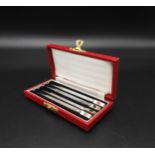 A SET OF FOUR SILVER PROPELLING PENCILS, each with machine turned barrels and decorated with hearts,